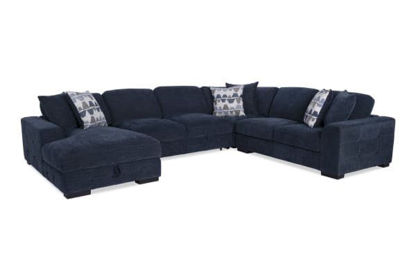 Contemporary Playground Navy 145" 4-piece sectional with left arm chaise, navy polyester fabric, tufted cushions, pop-up sleeper, and storage.