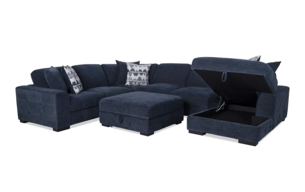 Contemporary Playground Navy 4-piece fabric polyester sectional with right arm chaise, pop-up sleeper loveseat, storage ottoman, and tufted cushions.