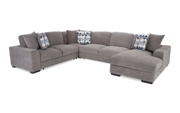 Contemporary Playground Gray 145'' 4-piece right arm facing sectional with plush polyester fabric, memory foam cushions, tufted detailing, storage chaise, and pop-up sleeper loveseat.