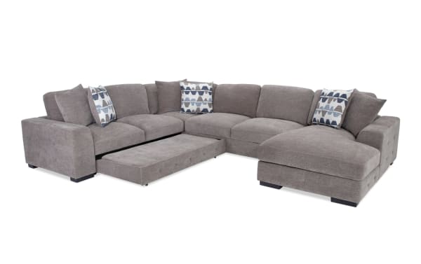 Contemporary Playground Gray 145'' 4-piece right arm facing sectional with polyester fabric, pop-up sleeper loveseat, chaise with storage, and tufted cushions.
