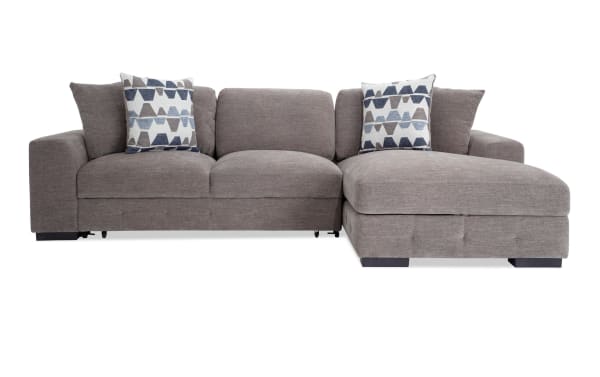 Contemporary Playground Gray 116'' 2 Piece Right Arm Facing Pop-Up Sleeper Chaise Sectional with gray polyester fabric, tufted cushions, oversized pillows, and storage chaise.