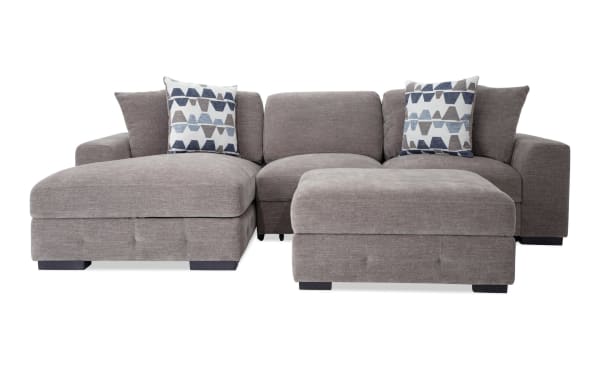 Contemporary Playground Gray 116'' 2-piece sectional with left arm chaise, polyester fabric, memory foam cushions, pop-up sleeper loveseat, storage ottoman, and four patterned accent pillows.