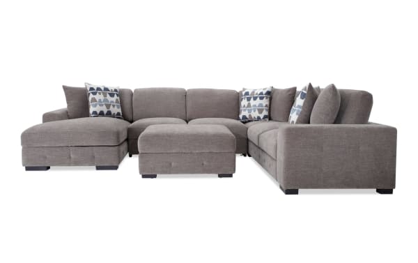 Contemporary Playground Gray 145'' 4-piece left arm facing sectional with polyester fabric, pop-up sleeper loveseat, storage chaise, and tufted ottoman.