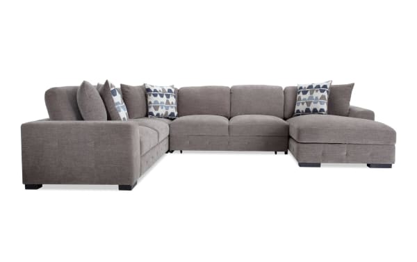 Playground Gray 145" 4-piece right arm facing chaise sectional with armless pop-up sleeper, gray polyester fabric, hand-tufted detailing, oversized pillows, and storage chaise in contemporary style.