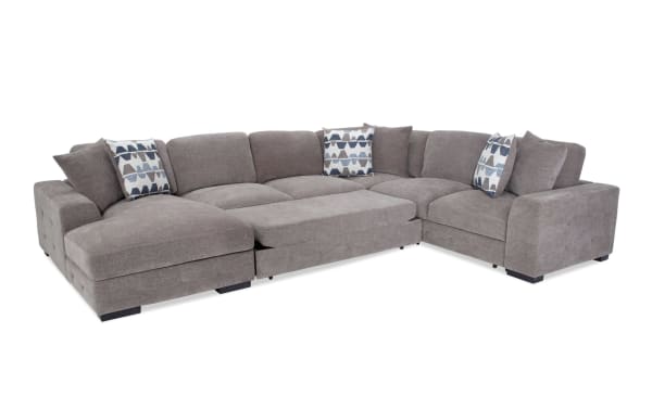 Contemporary Playground Gray 145'' 4-piece left arm chaise sectional in plush polyester fabric with memory foam cushions, tufted detailing, and pop-up sleeper.