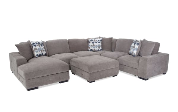 Playground Gray 4-piece left arm chaise sectional with armless pop-up sleeper and storage ottoman, gray polyester fabric, contemporary style, tufted detailing, memory foam cushions, and oversized accent pillows.