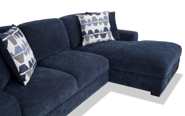 Playground Navy 116'' 2 Piece Right Arm Facing Chaise Sectional in navy blue polyester fabric with deep memory foam cushions, hand-tufted detailing, and oversized geometric accent pillows, designed for small spaces and apartment living.