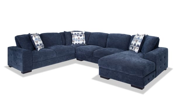Contemporary Playground Navy 145'' 4-piece right arm facing chaise sectional in plush polyester fabric with deep memory foam cushions and tufted detailing.
