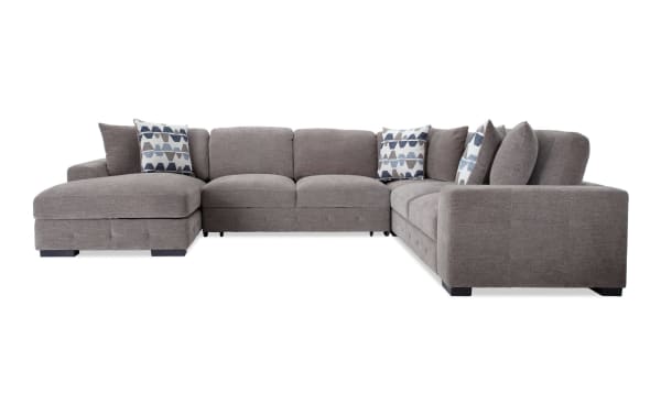 Contemporary Playground Gray 145'' 4 Piece Left Arm Facing Chaise Sectional in plush polyester fabric with deep memory foam cushions and tufted detailing, featuring ample chaise storage and six oversized accent pillows.