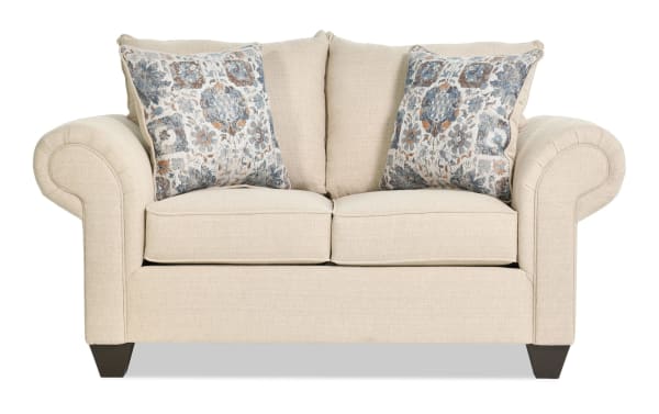 Chloe Beige 67'' Loveseat from Chloe Living collection, transitional style in beige polyester fabric with rolled arms, coil springs, and two patterned accent pillows.