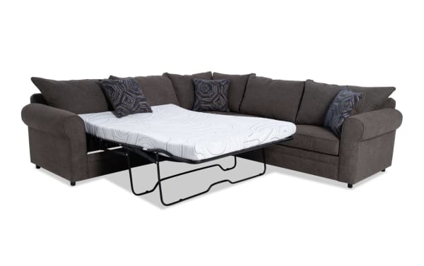 Juno Chocolate 114" 3-piece left-arm facing sleeper sectional in brown polyester fabric with transitional style, featuring a full-size pull-out cooling gel memory foam mattress and patterned accent pillows.