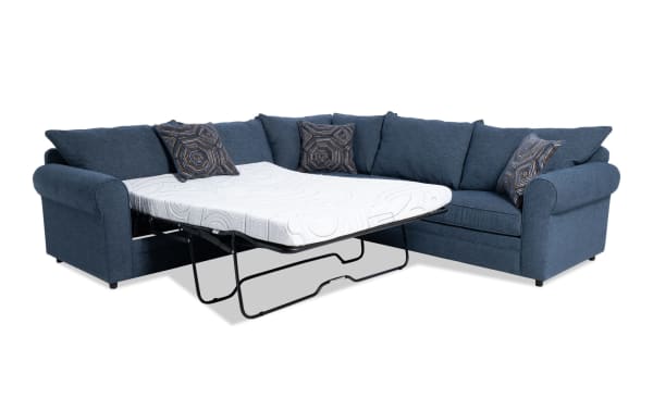 Juno Denim 114" 3-piece left arm facing sleeper sectional in blue polyester fabric with transitional style, featuring a pull-out cooling gel memory foam mattress and patterned accent pillows.