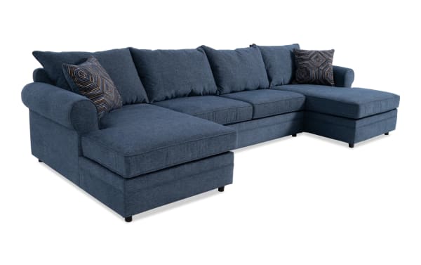 Juno Denim 142'' 3 Piece Dual Chaise Sectional in blue polyester fabric with transitional style, featuring plush cushions and patterned accent pillows.