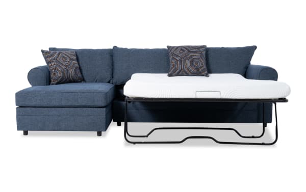 Juno Denim 114'' 2 Piece Left Arm Facing Sleeper Chaise Sectional in blue polyester fabric with transitional style, featuring a pull-out gel memory foam mattress and patterned accent pillows.