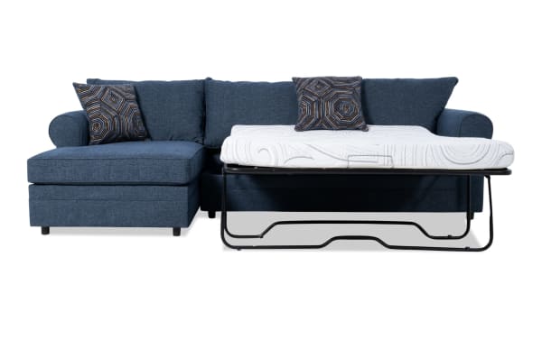 Juno Denim 114'' 2 Piece Left Arm Facing Sleeper Chaise Sectional in blue polyester fabric with transitional style, featuring a pull-out cooling gel memory foam mattress and geometric accent pillows.