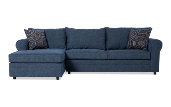 Juno Denim 114" left arm facing sleeper chaise sectional in blue polyester fabric with transitional style, featuring Bob-O-Pedic cooling gel memory foam mattress and patterned accent pillows.