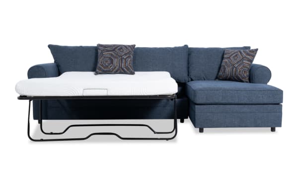 Juno Denim 114" 2 Piece Right Arm Facing Sleeper Chaise Sectional in blue polyester fabric with gel memory foam mattress and patterned accent pillows.