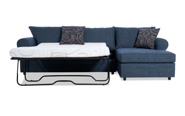 Juno Denim 114'' 2 Piece Right Arm Facing Sleeper Chaise Sectional in blue polyester fabric with transitional style, featuring a pull-out cooling gel memory foam mattress and patterned accent pillows.