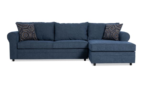 Juno Denim 114" 2-piece right arm facing sleeper chaise sectional in blue polyester fabric. Transitional style with plush cushions, patterned accent pillows, and a cooling gel memory foam mattress for comfort.