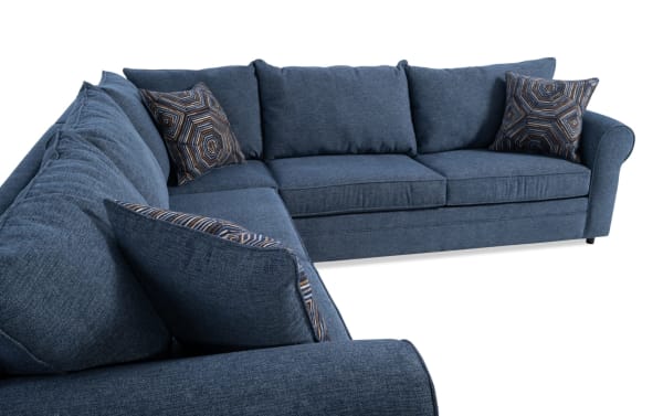 Juno Denim 114'' 3 Piece Sectional in blue polyester fabric with transitional style, featuring plush cushions and patterned accent pillows.