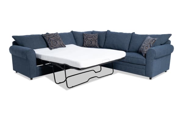 Juno Denim 114" 3-piece left arm facing sleeper sectional in blue polyester fabric with transitional style, featuring a full-size pull-out gel memory foam mattress and patterned accent pillows.
