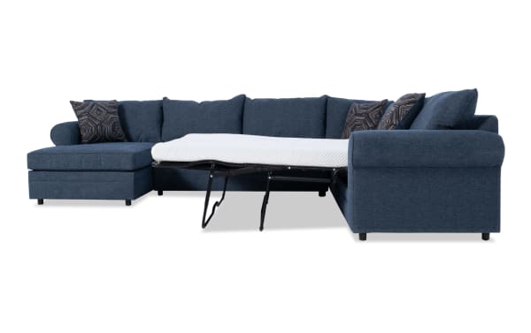 Juno Denim 142" 4-piece left arm facing sleeper chaise sectional in blue polyester fabric with transitional style. Features pull-out gel memory foam mattress and patterned accent pillows.