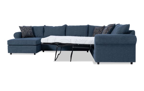 Juno Denim 142" 4-piece left arm facing sleeper chaise sectional in blue polyester fabric with transitional style, featuring a full-size pull-out cooling gel memory foam mattress and patterned accent pillows.