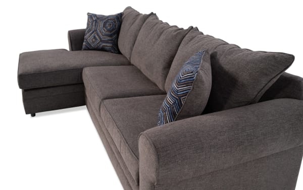 Juno Chocolate 114" 2 Piece Left Arm Facing Chaise Sectional in brown polyester fabric, transitional style with plush cushions and patterned accent pillows.