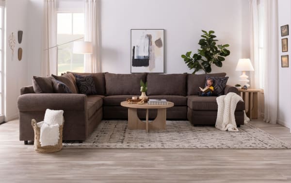 Juno Chocolate 114'' 2 Piece Left Arm Facing Sleeper Chaise Sectional in brown polyester fabric with transitional style, plush cushions, and pull-out gel memory foam mattress.