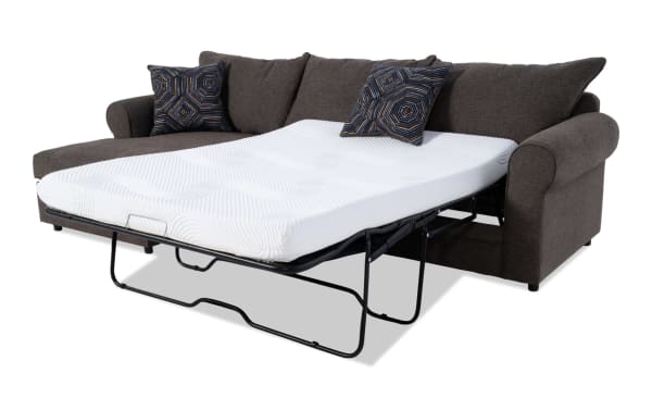 Juno Chocolate 2-piece left arm facing sleeper chaise sectional in brown polyester fabric with transitional style, featuring a full-size pull-out gel memory foam mattress and patterned accent pillows.