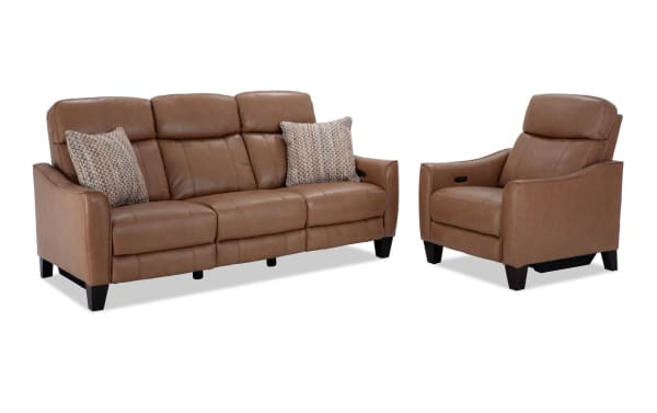 Empire Cognac leather 82" power reclining sofa and matching recliner with power headrest, transitional style, brown leather upholstery, vinyl accents, and included accent pillows.
