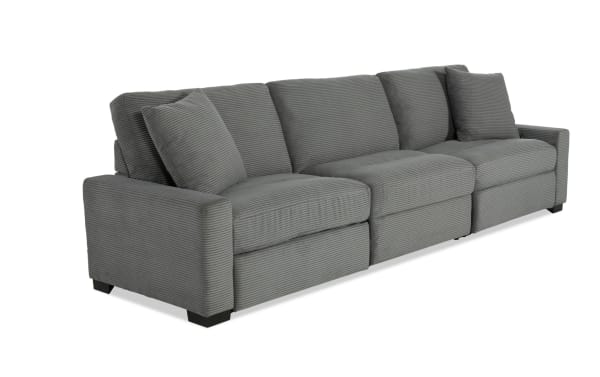 Aspen Charcoal 127'' transitional power reclining sofa in gray polyester fabric with USB and USB-C ports, plush cushions, and accent pillows for enhanced comfort.