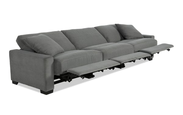 Aspen Charcoal 127'' power reclining sofa in gray polyester fabric with USB & USB-C ports, plush cushions, accent pillows, and transitional style.