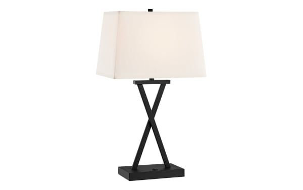 Calvin Black Table Lamp with cream polyester fabric shade, black metal X-shaped base, transitional style for modern nightstands or end tables.