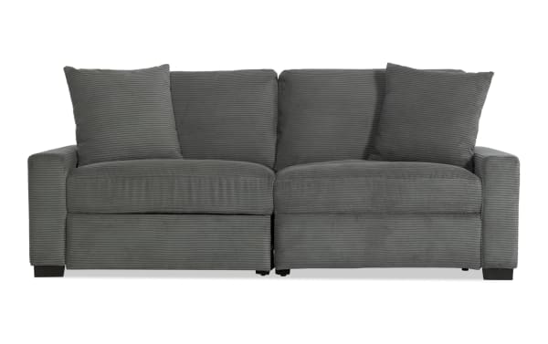 Aspen Charcoal 88" power reclining loveseat in gray polyester fabric, transitional style with plush cushions, accent pillows, and USB/USB-C ports.