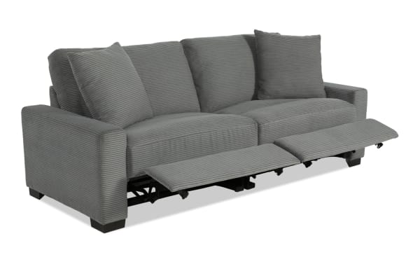 Aspen Charcoal 88" power reclining loveseat in gray polyester fabric with plush cushions, accent pillows, and USB/USB-C ports, transitional style.