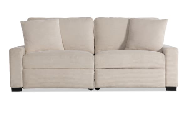 Beige Aspen Power transitional 88-inch loveseat with plush polyester fabric, power reclining seats, USB and USB-C ports, and accent pillows.