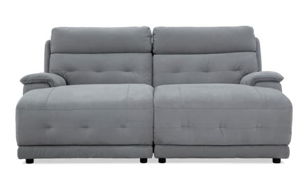Contemporary Rumor Gray 84'' power reclining dual chaise sofa with power headrest, gray polyester fabric upholstery, plush cushions, and chaise lounge.