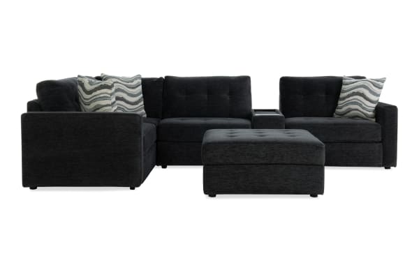 Charcoal gray Modular Bob® 129" 6-piece contemporary fabric sectional with armless storage chair, console with USB ports, corner seat, and storage ottoman.
