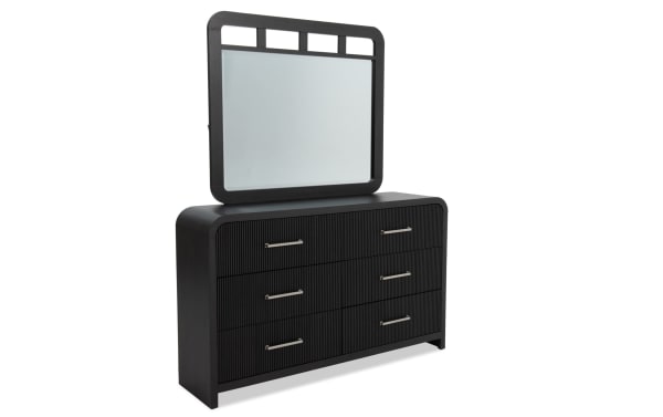 Cascade Black 6 Drawer Dresser & Mirror in transitional style, featuring black engineered wood grain MDF, reeded drawer fronts, rounded corners, and a large matching mirror.