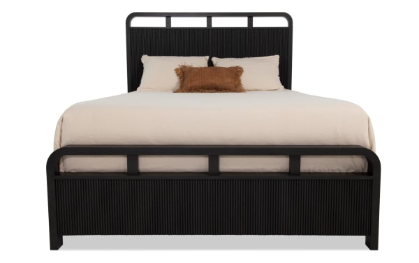 Cascade Twin Black Panel Bed from Cascade Bedroom collection, transitional style with black MDF and engineered wood grain. Features delicate reeding, smooth corners, and four symmetrical openings on headboard and footboard.