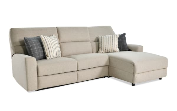 Modern Farmhouse beige 2-piece right-arm fabric sectional with power reclining seats, headrests, accent pillows, and chaise lounge.