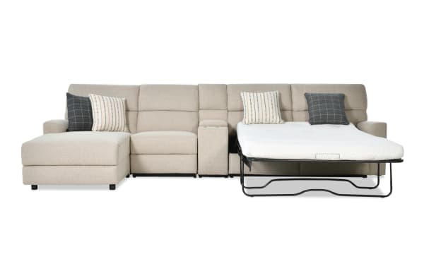 Modern Farmhouse beige 4-piece left arm facing power reclining sleeper sectional with fabric polyester upholstery, gel mattress, power headrest, and accent pillows.