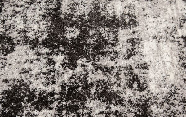 Galaxy 8' x 10' Black Abstract Rug with transitional style, heat set polypropylene fabric in black and white abstract pattern for modern living spaces.