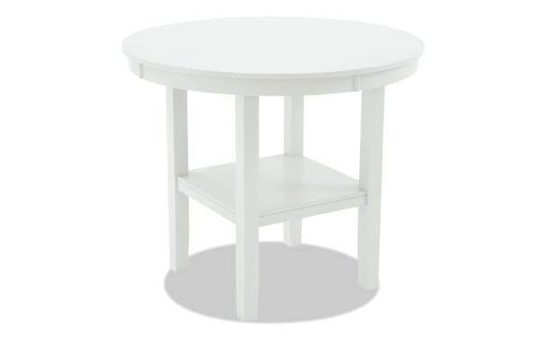 London White Round Counter Height Dining Table from London Dining collection, contemporary style, sturdy white MDF with lower shelf and four legs.