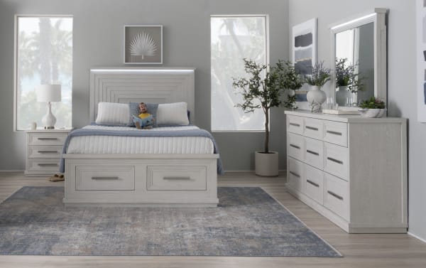 Contemporary Infinity 4 Piece Queen White Storage Bedroom Set in MDF with 18 drawers, LED-lit headboard, beveled mirror, built-in charging ports, and cedar-lined storage.