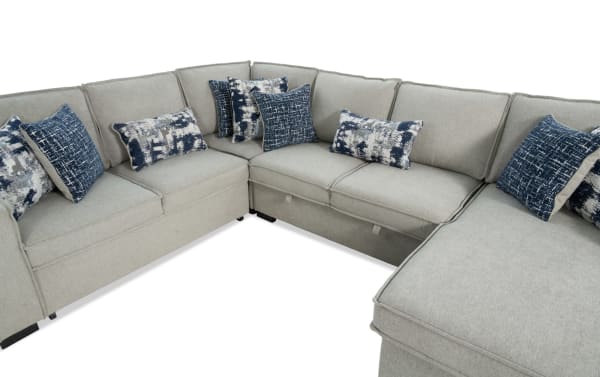 Playmax Gray 124'' 4-piece right arm facing transitional sectional with gray polyester fabric upholstery, memory foam seating, pop-up sleeper chaise, USB & USB-C ports, and accent pillows.