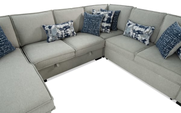 Gray Playmax 124" 4-piece left arm facing transitional sectional with polyester fabric, memory foam seating, pop-up sleeper, USB/USB-C ports, and accent pillows.