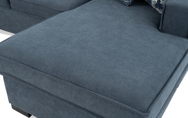 Gray polyester fabric upholstery on the Playmax Denim 94'' 2 Piece Right Arm Facing Pop-Up Sleeper Chaise Sectional with plush cushioning and transitional style.