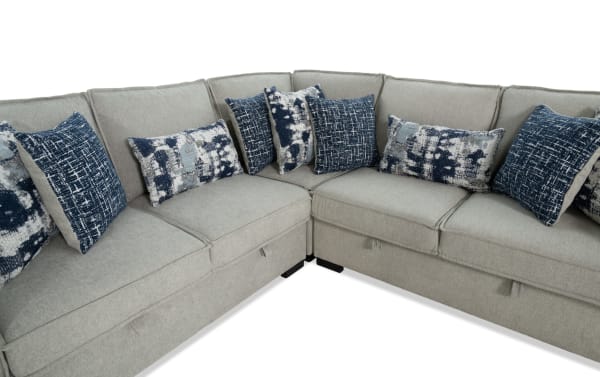 Gray 99-inch Playmax 3-piece transitional sectional with polyester fabric upholstery, memory foam seating, built-in USB/USB-C ports, and patterned accent pillows.